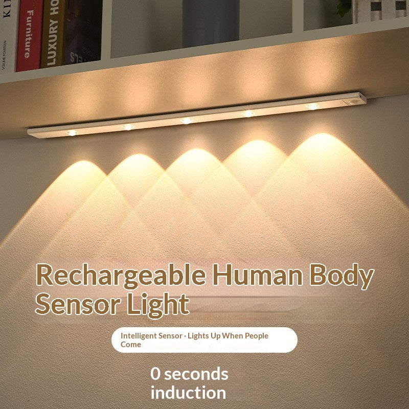 Smart LED Motion-sensor Light Strip For Cabinets illuminating a shelf with warm light.