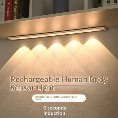 Smart LED Motion-sensor Light Strip For Cabinets illuminating a shelf with warm light.